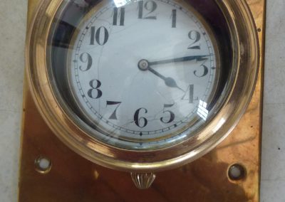 Footboard clock in brass case
